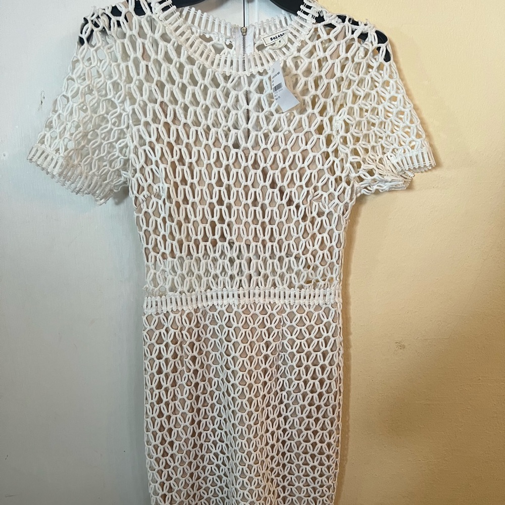 White Soleblu dress with tan lining. Size small.  Zipper on back.